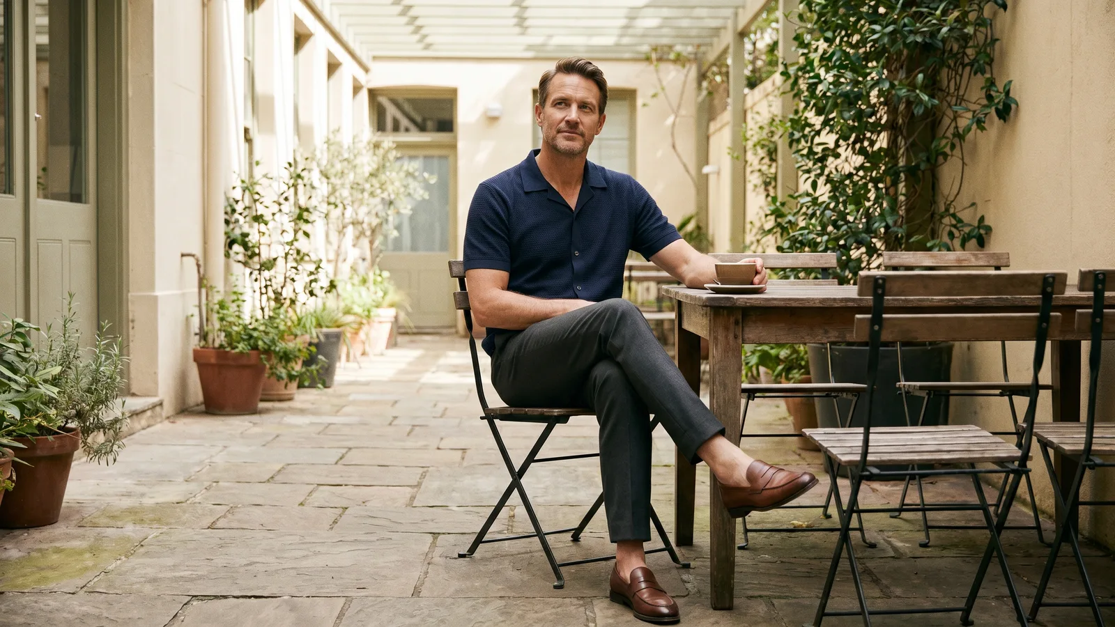 Man in a crisp short sleeve collared shirt looking business casual in an everyday setting.